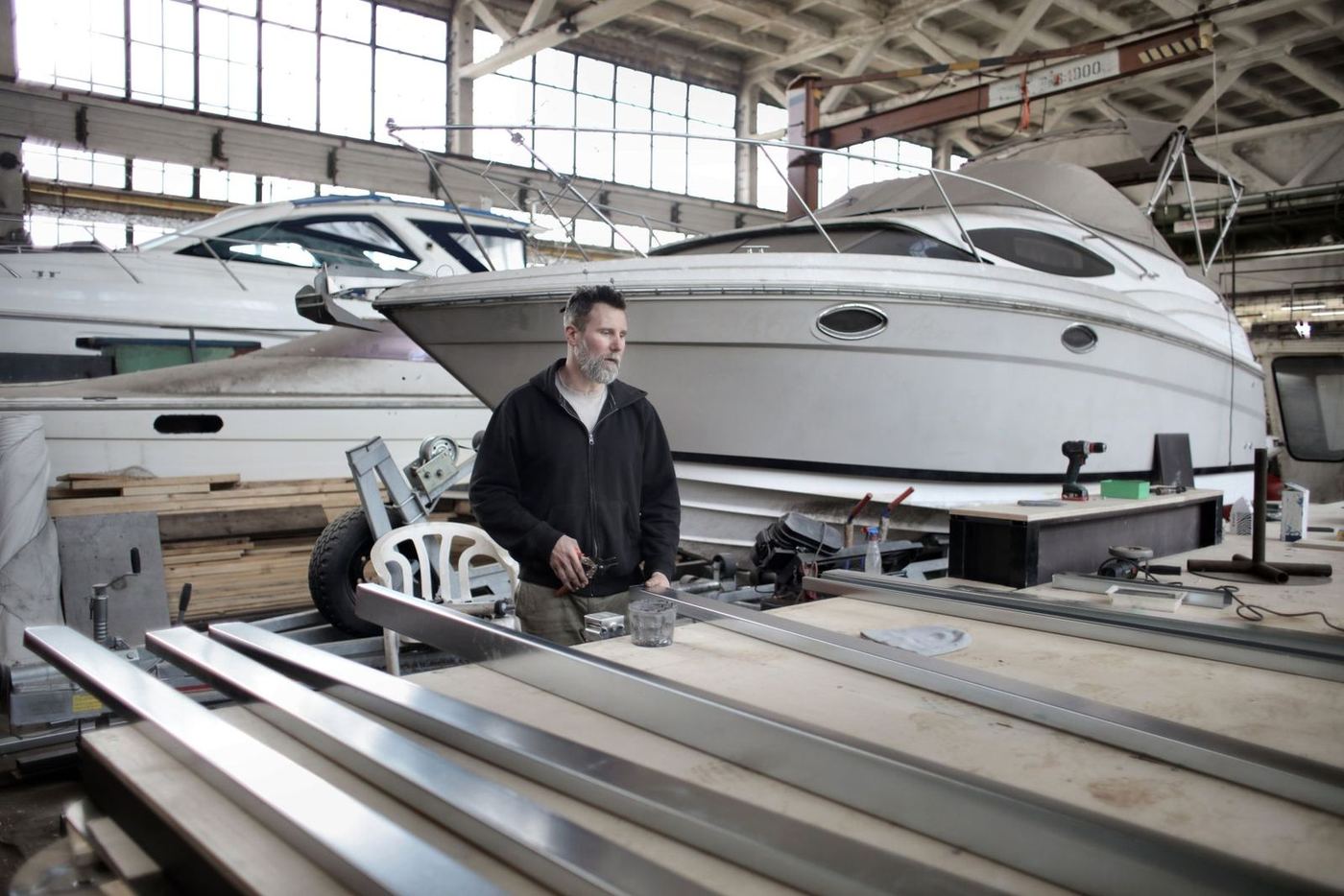 Marine technician working in a boat workshop